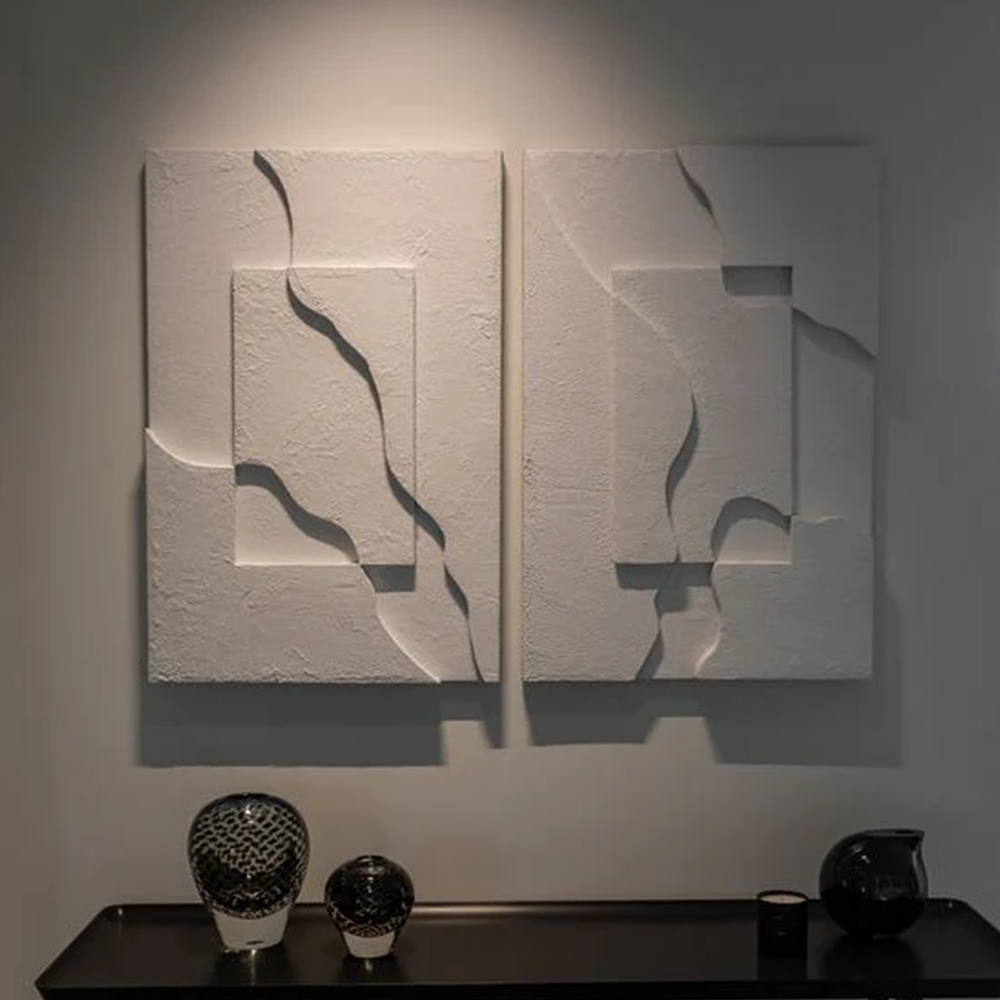Modern metallic sculpture, Elevé, features a fractured terrain design